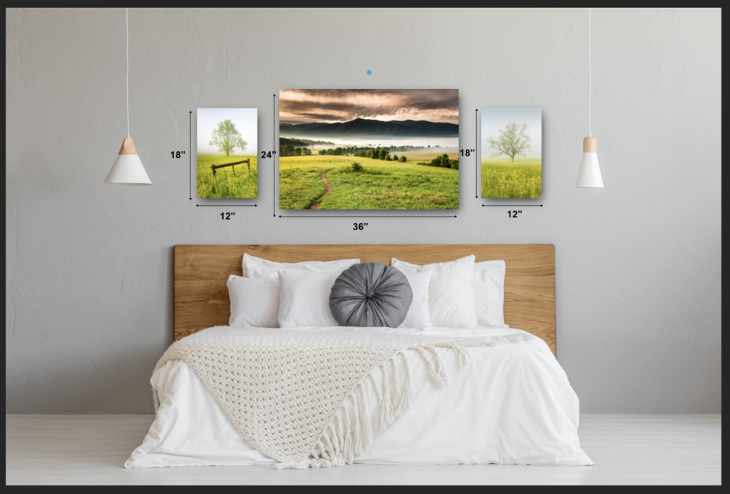 An example grouping of landscape prints hung over the headboard of a bed. One 24"x36" horizontal landscape image with smaller 12"x18" vertical landscape images on each side.